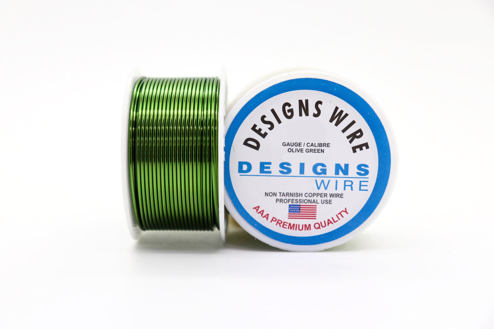 A spool of DESIGNS WIRE copper base wire in green olive plating, with the label visible on the spool.